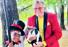 "Children and parents enjoying Uncle Buck's magic show in Charlotte"