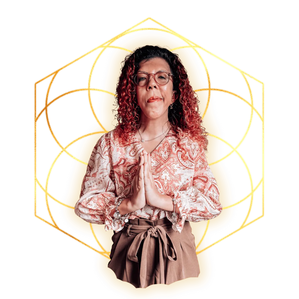 A smiling, warm, grounded, and spiritual woman and lightworker. Full of both strength and softness. Wearing earth-toned clothes, red curly hair, smiling, with hands joined in a namaste greeting. Sacred geometry in gold as the background.