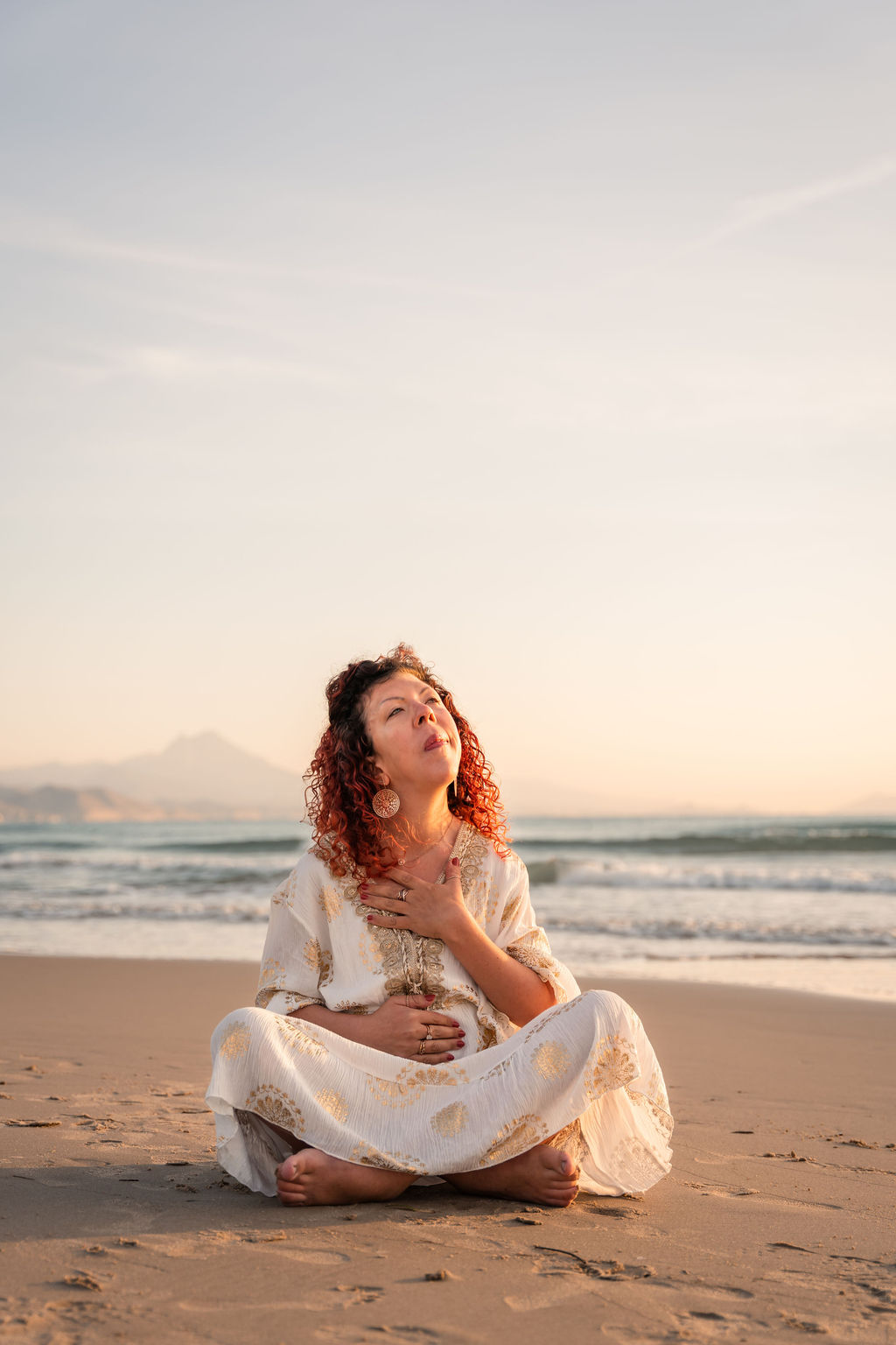 A woman that feels held by her self, Spirit and Univere.