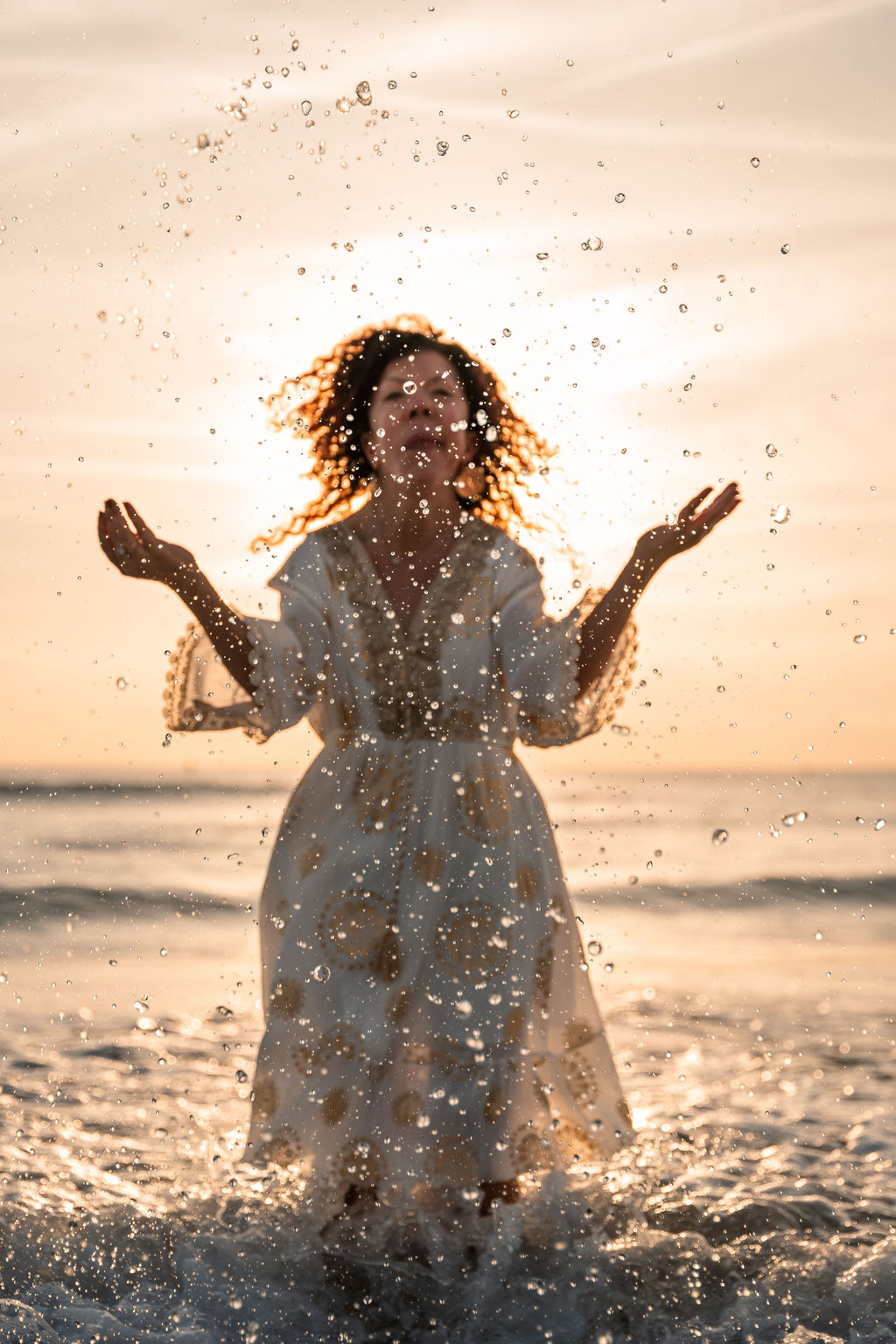 Play, power, magic, unity, ocean, splashes, and sunrise in authentic presence are some of the elements that describe this image. The channel and the Universe in perfect harmony — in unity.