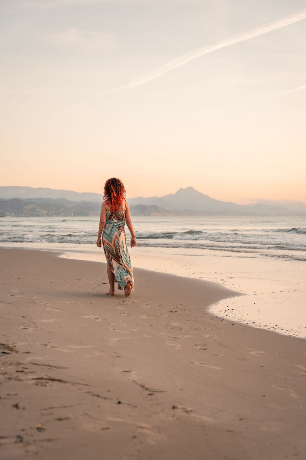 A woman surrounded by grass, trees and bushes. In the nature – free, happy, joyful, connected. Mother Earth, steady in self-trust, led by spirit and her highest self. Powerful alchymist.