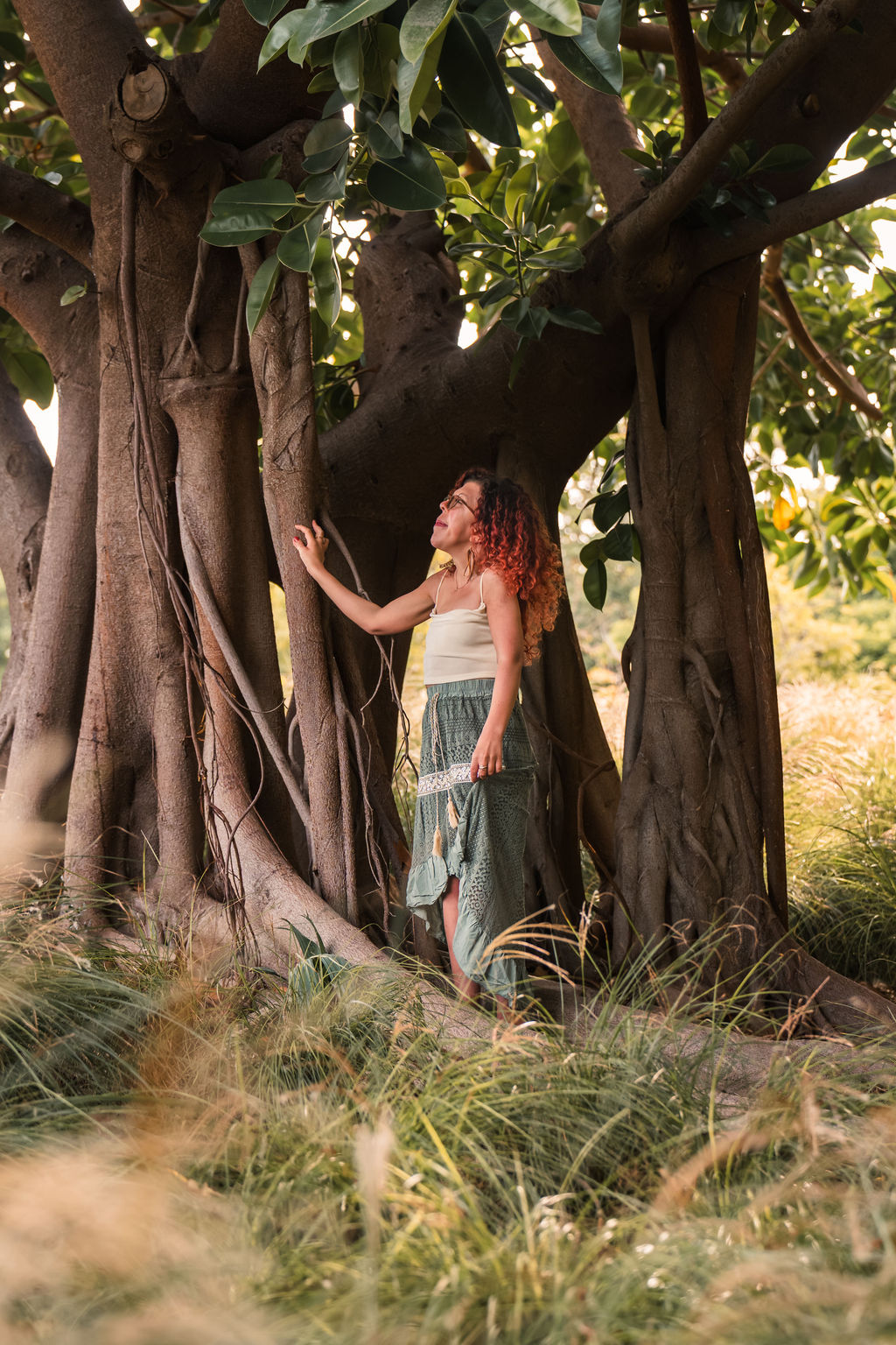 A woman in contact with Mother Gaia, Mother Earth – the nature. A magnificent tree, big and powerful. But simultaniously grounded.