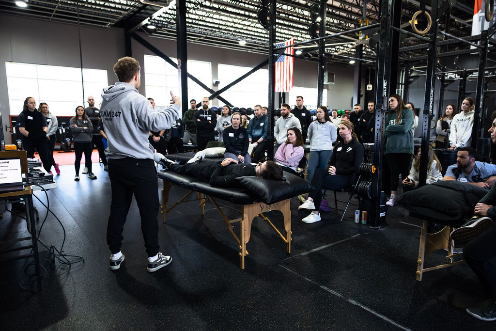Physical therapist filming runner on treadmill