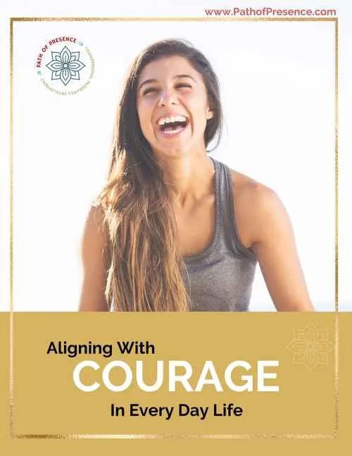 A confident individual in a casual top embodies strength and resilience against a light background