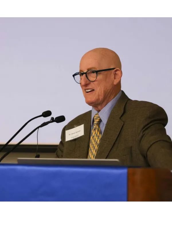 Dr. Harry Agress Jr. at a podium