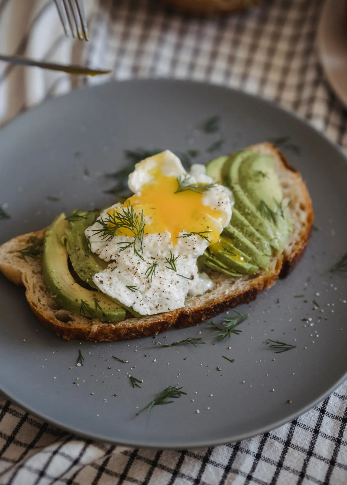 Cooked eggs and avocado on a plate