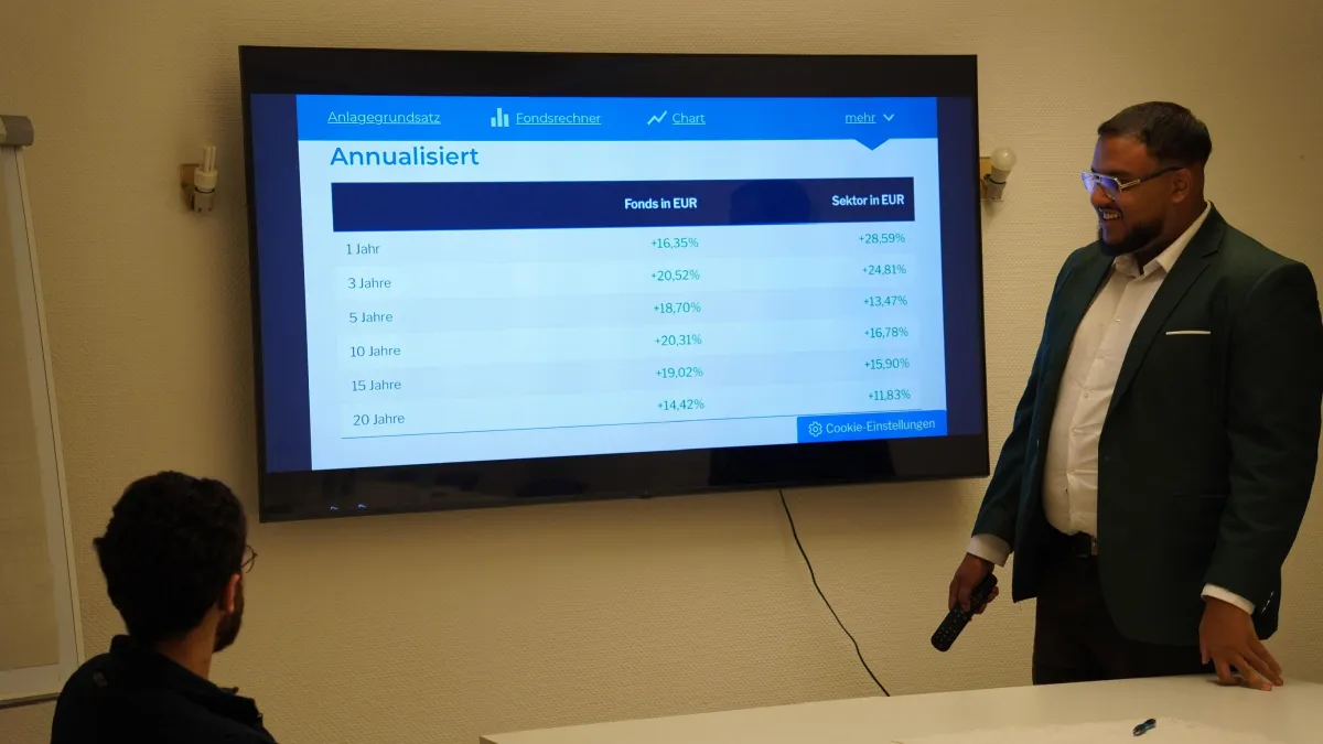 a person holding a cell phone with a chart on it