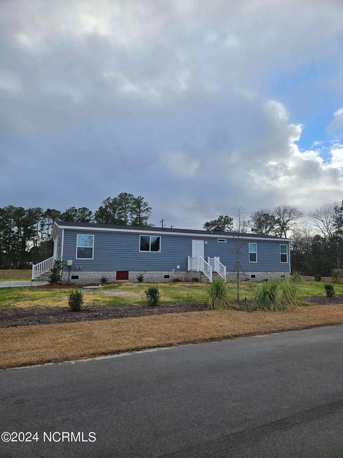 Right side of a brand new home located at 864 Yaupon Drive SW, Calabash, NC