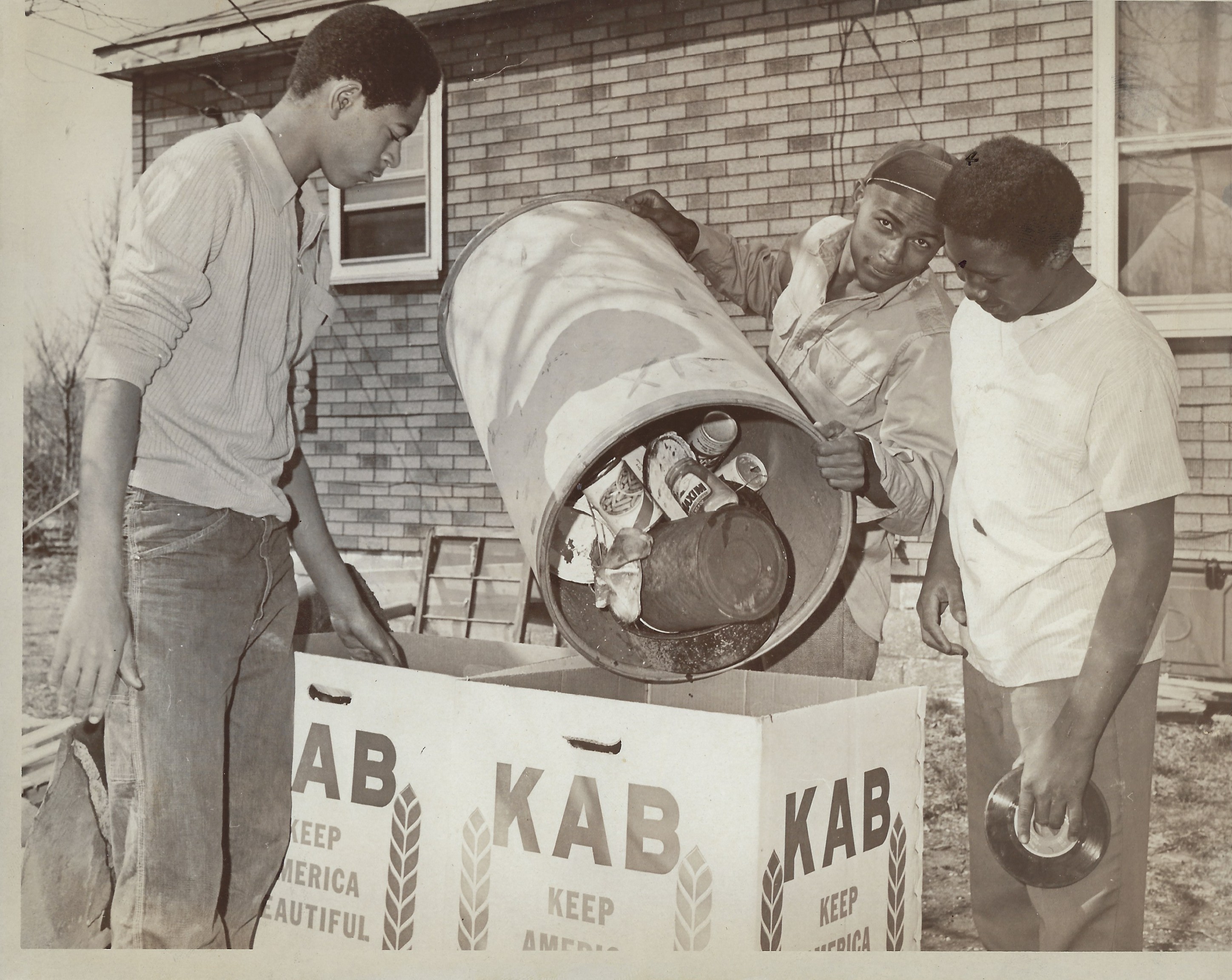 historical photo of young men collecting litter