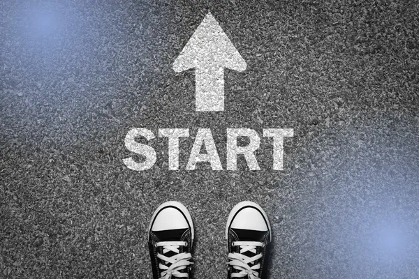 Standing at the starting line of a competition, representing courage and readiness under pressure