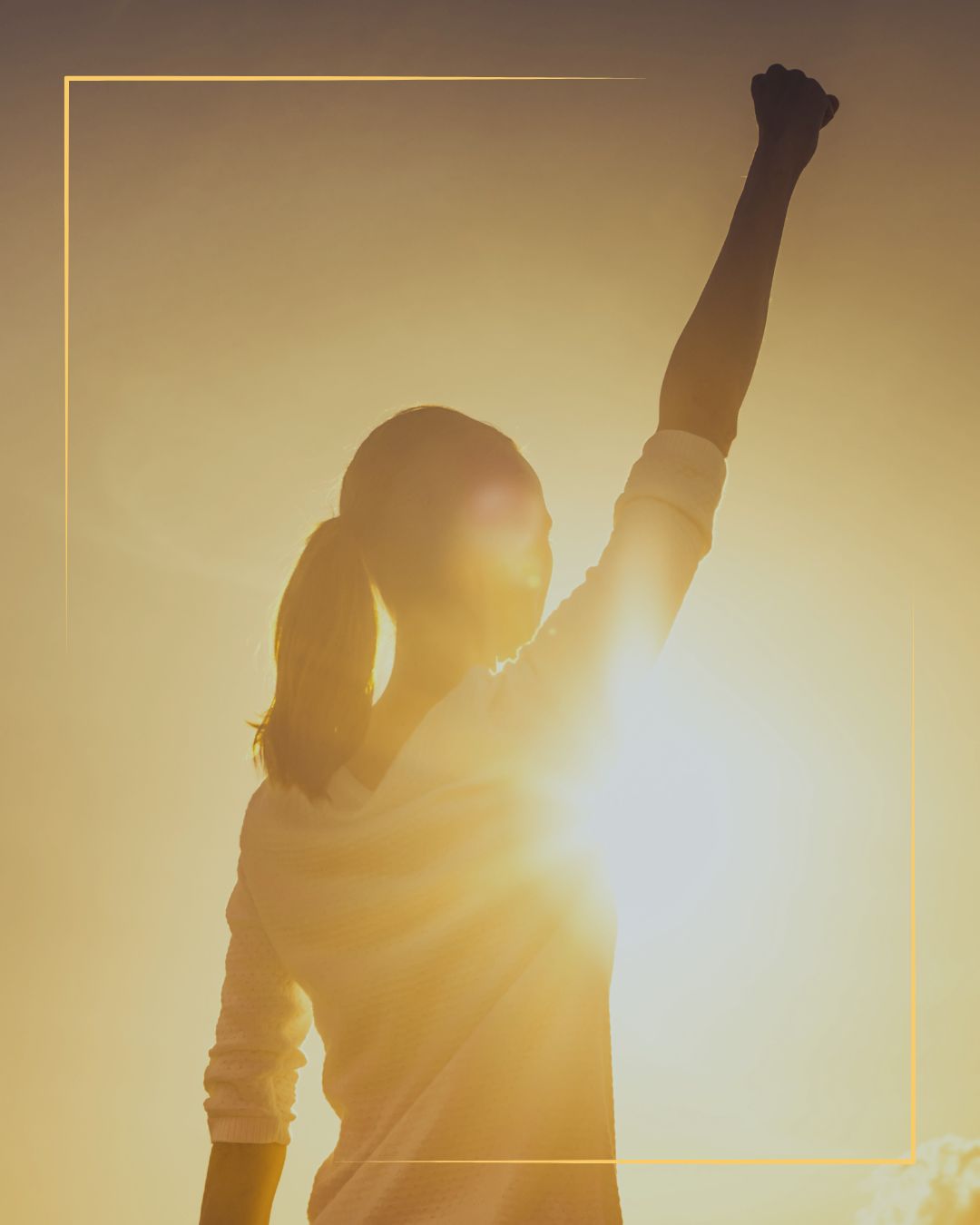 Female athlete looking tot the sun showing her power and mental edge before an event