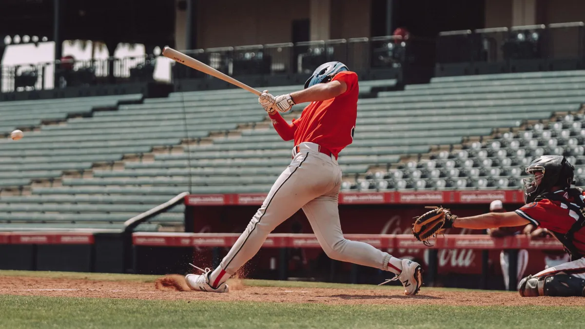 Baseball hitter committing fully to the swing — decisiveness in sports