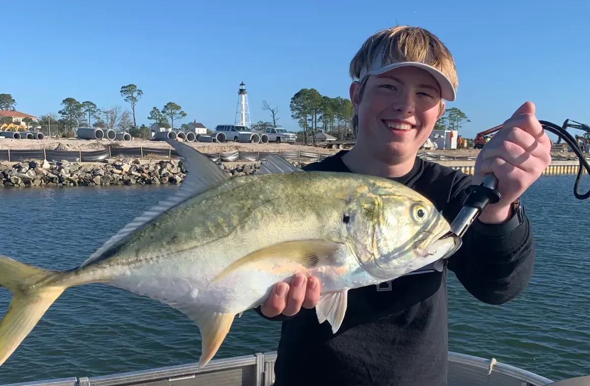 T-Man’s fishing charter boat cruising through the waters of Cape San Blas, Florida during a deep sea excursion