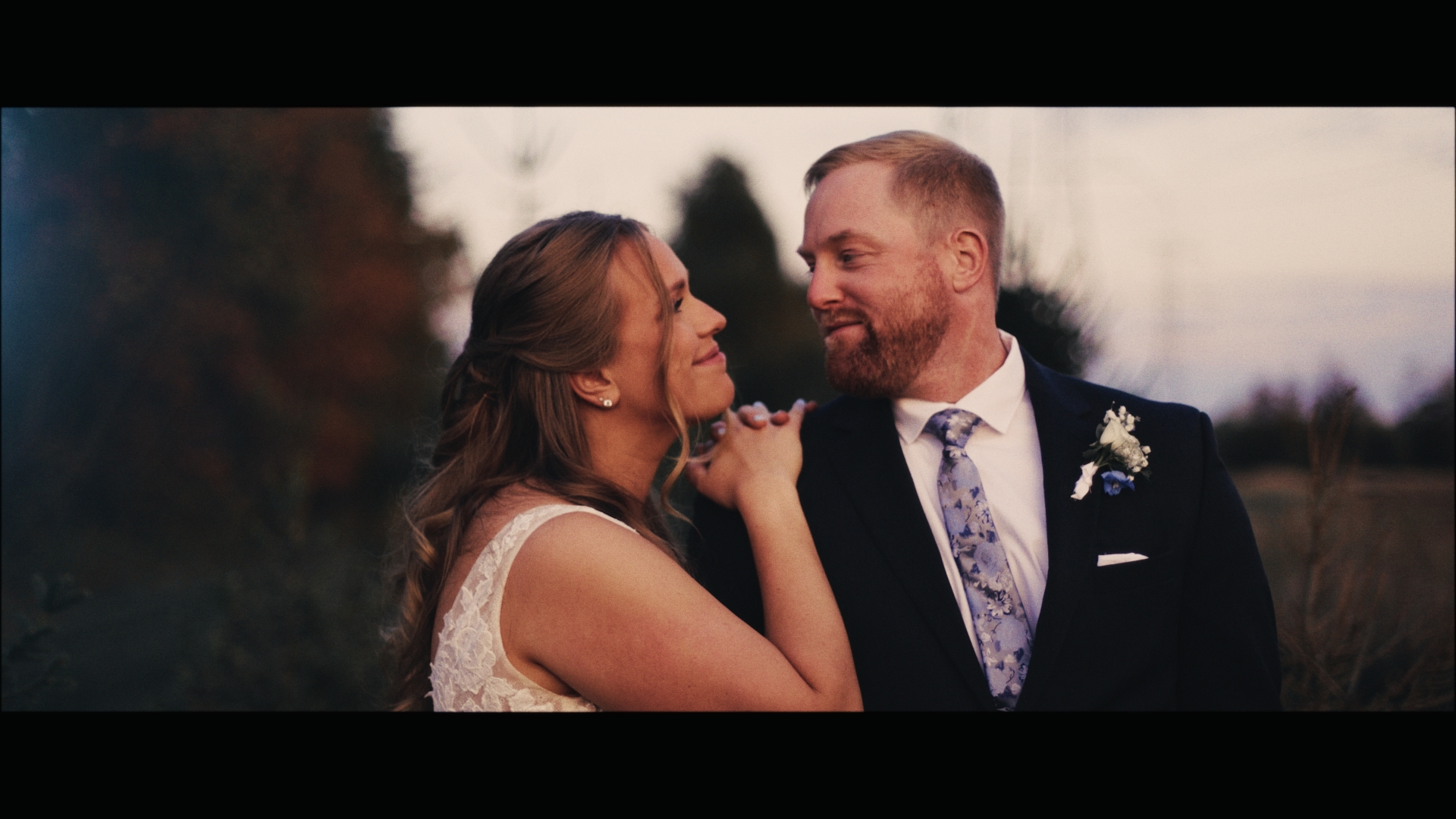 Cinematic wedding film still of a couple sharing an intimate moment, captured by Garden of Love Films with a warm, documentary storytelling approach.