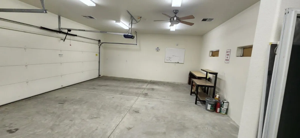 A person riding a bike with a large bag on the back of it