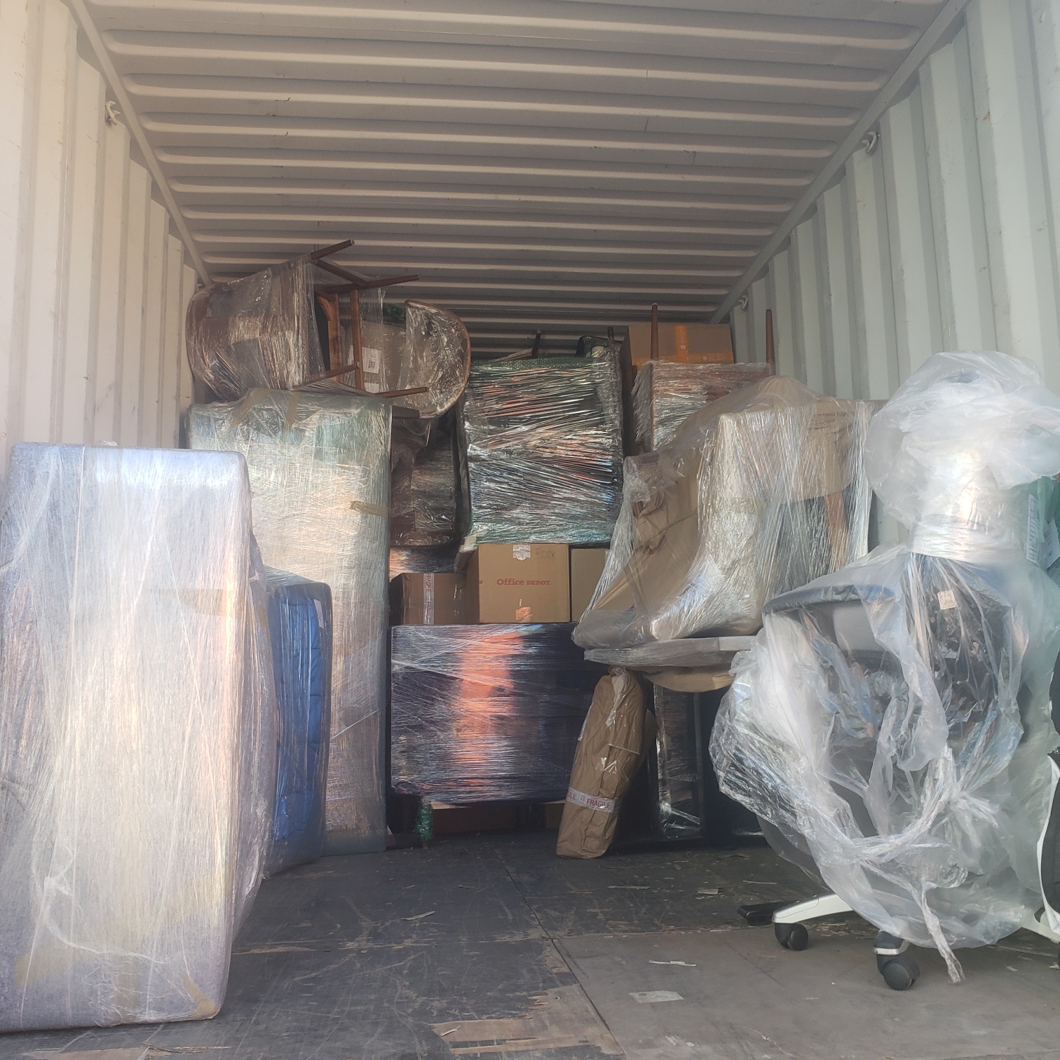 A delivery truck is parked on a city street.