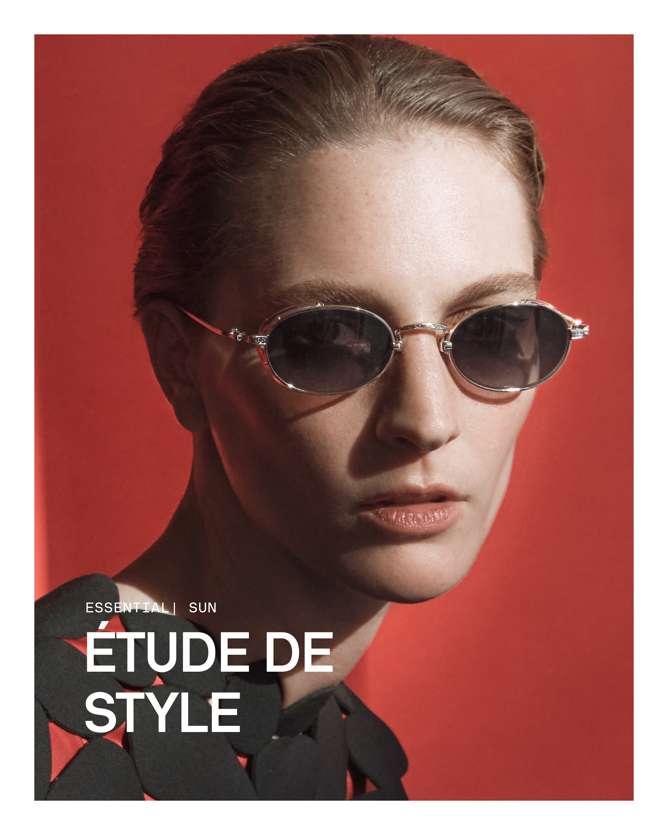 Model wearing oval silver Matsuda sunglasses against a bold red background.