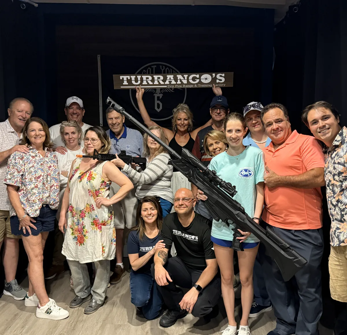 Corporate Group posing with Turrangos sign