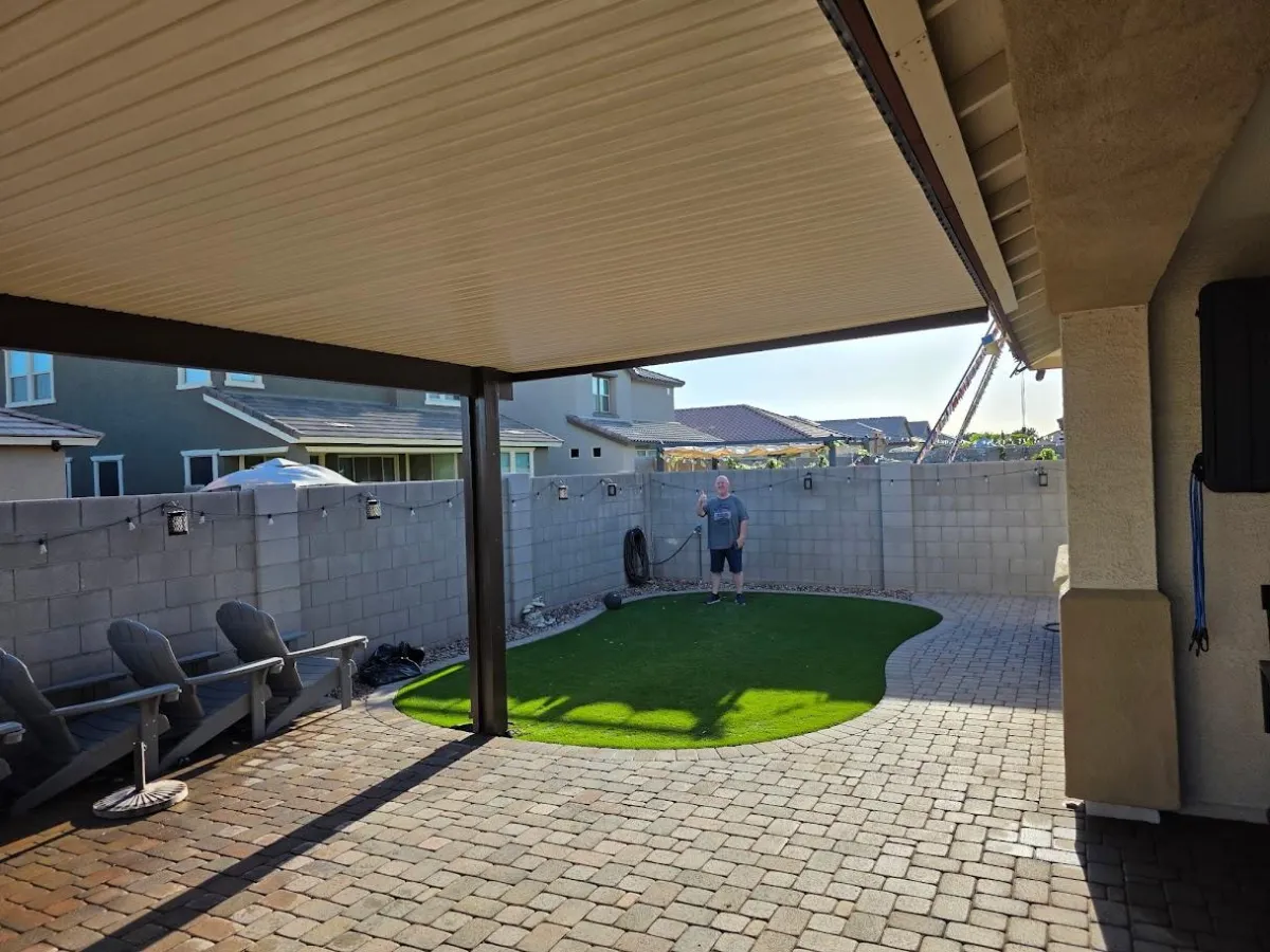 a large wooden wheel with red sticks sticking out of it