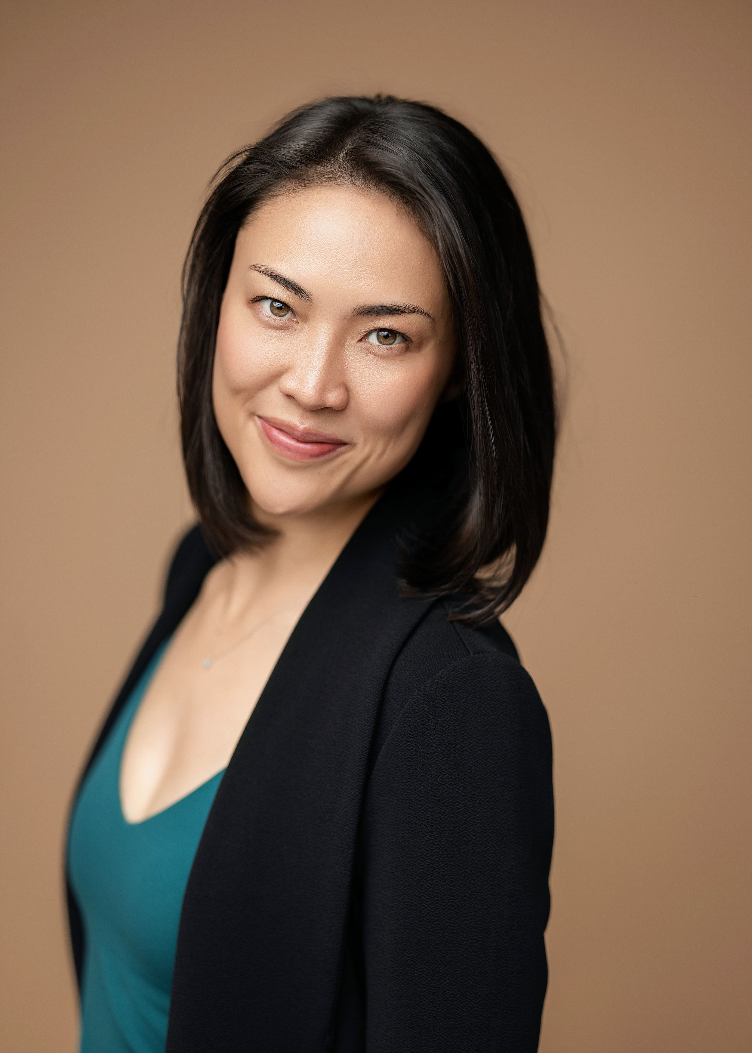 Danielle YS smiles and looks towards you