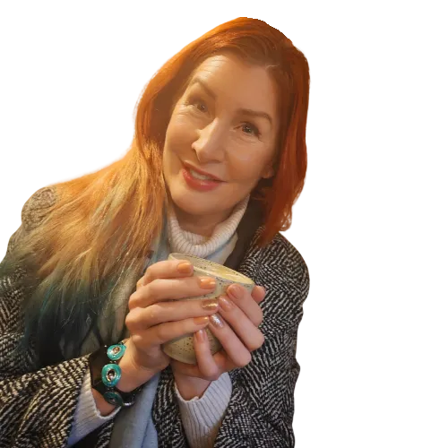 Beccy drinking herbal tea from a ritual cup. She is happy and confident with glowing skin and looks healthy