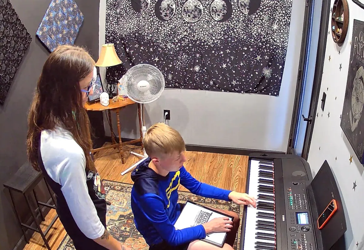 Instructor and Student in piano lesson