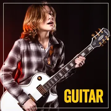 Child taking guitar lesson in Greenwood, Indiana
