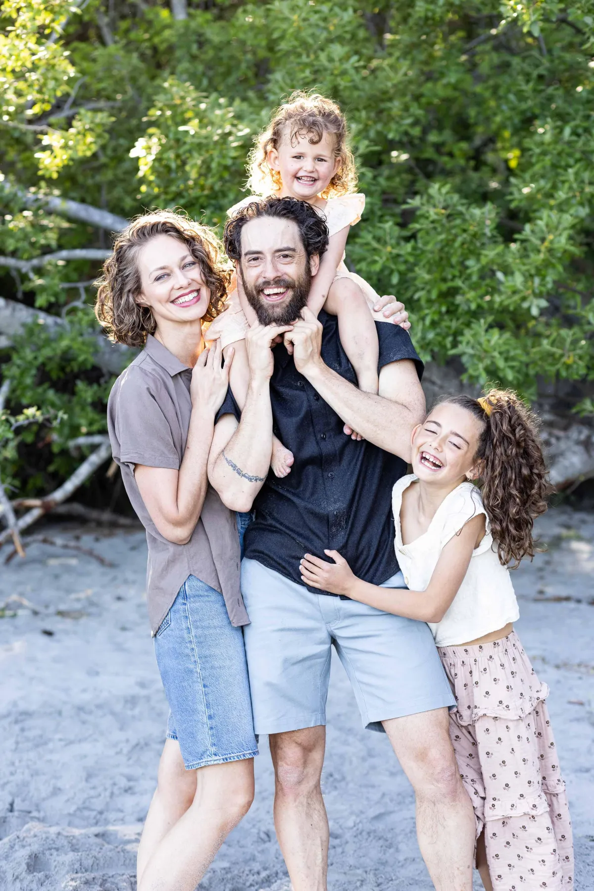 Family photo of 4 on Aylard Farm Beach in East Sooke Park