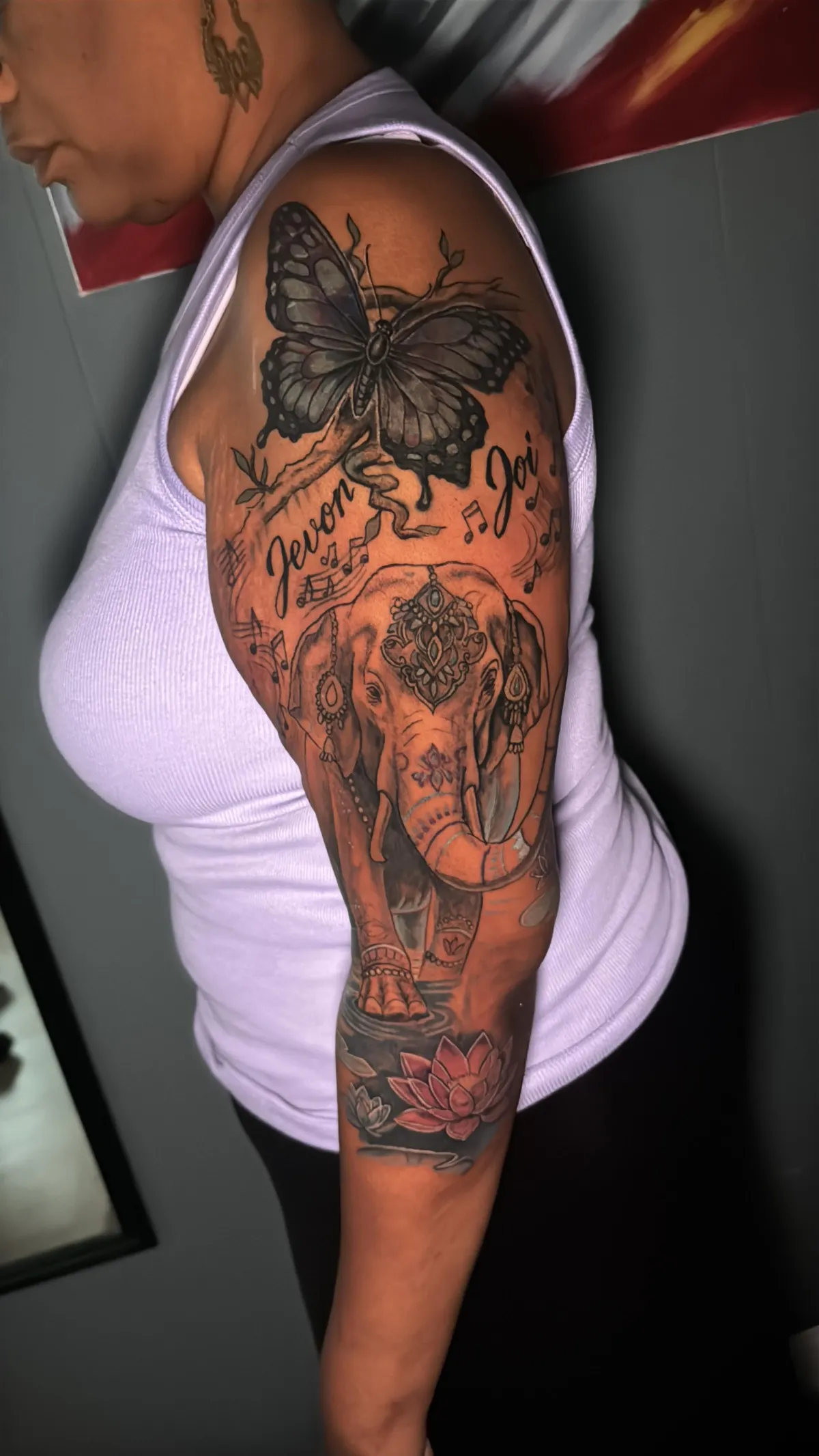 Butterfly and elephant sleeve Custom butterfly, elephant and lotus floral sleeve tattoo on a Black woman