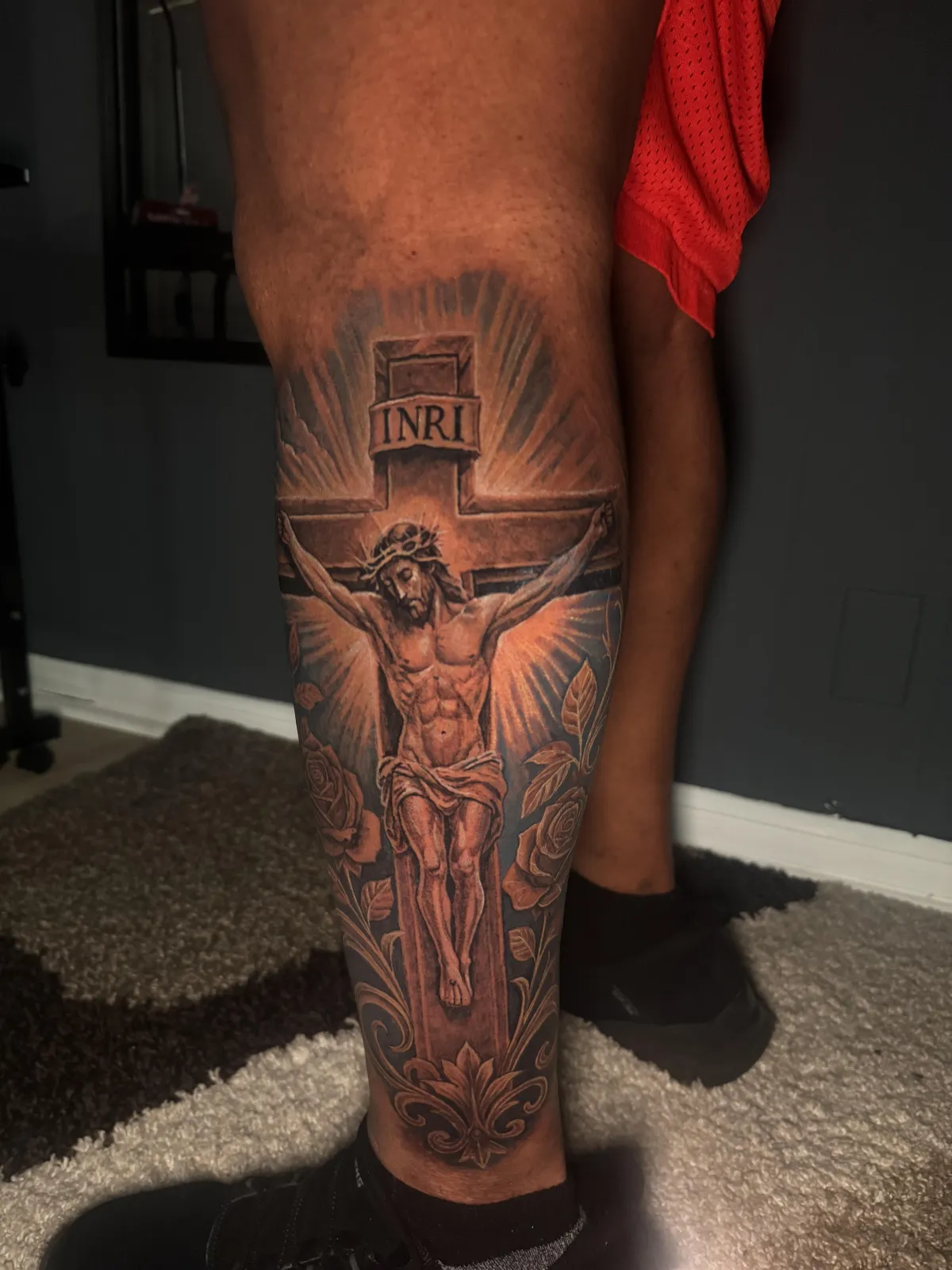 Jesus crucifixion tattoo Black and grey realism Jesus crucifixion tattoo covering the lower leg