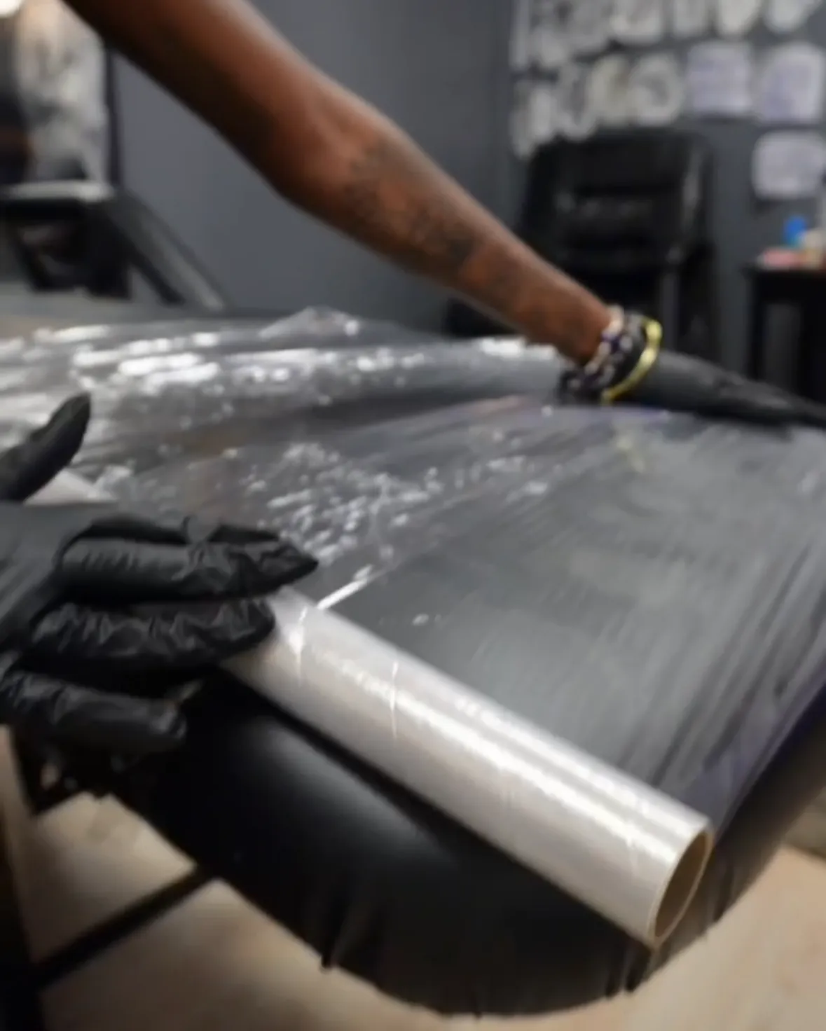 Preparing and wrapping the tattoo station before a client appointment