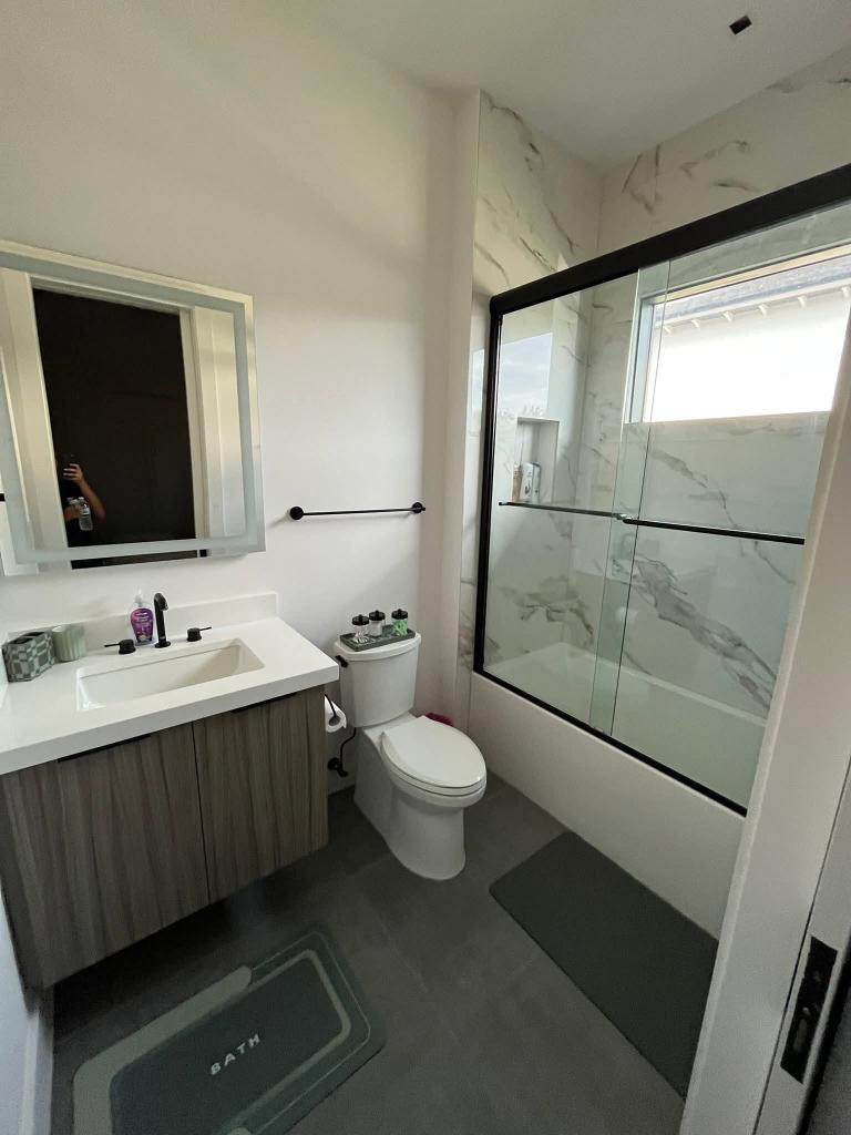 Organized bedroom with neatly made bed