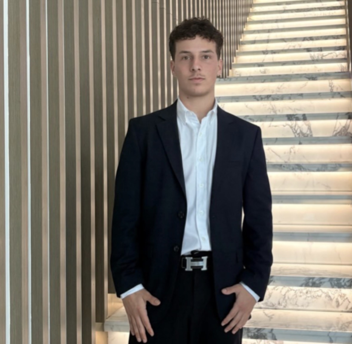 Professional real estate advisor overlooking Dubai marina skyline