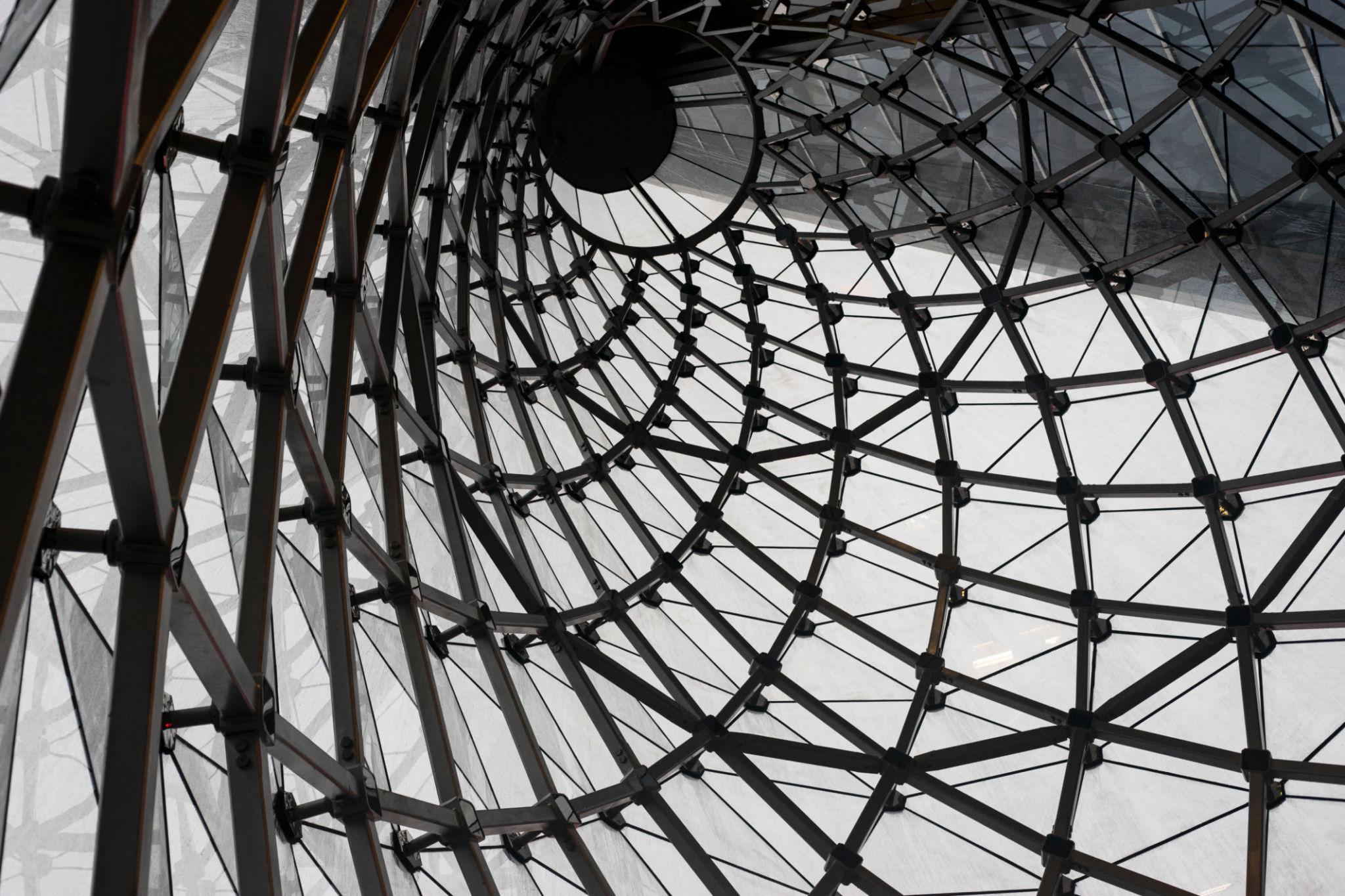 Symmetrical architectural spiral representing the layered process of strategic decision-making and analytical thinking.