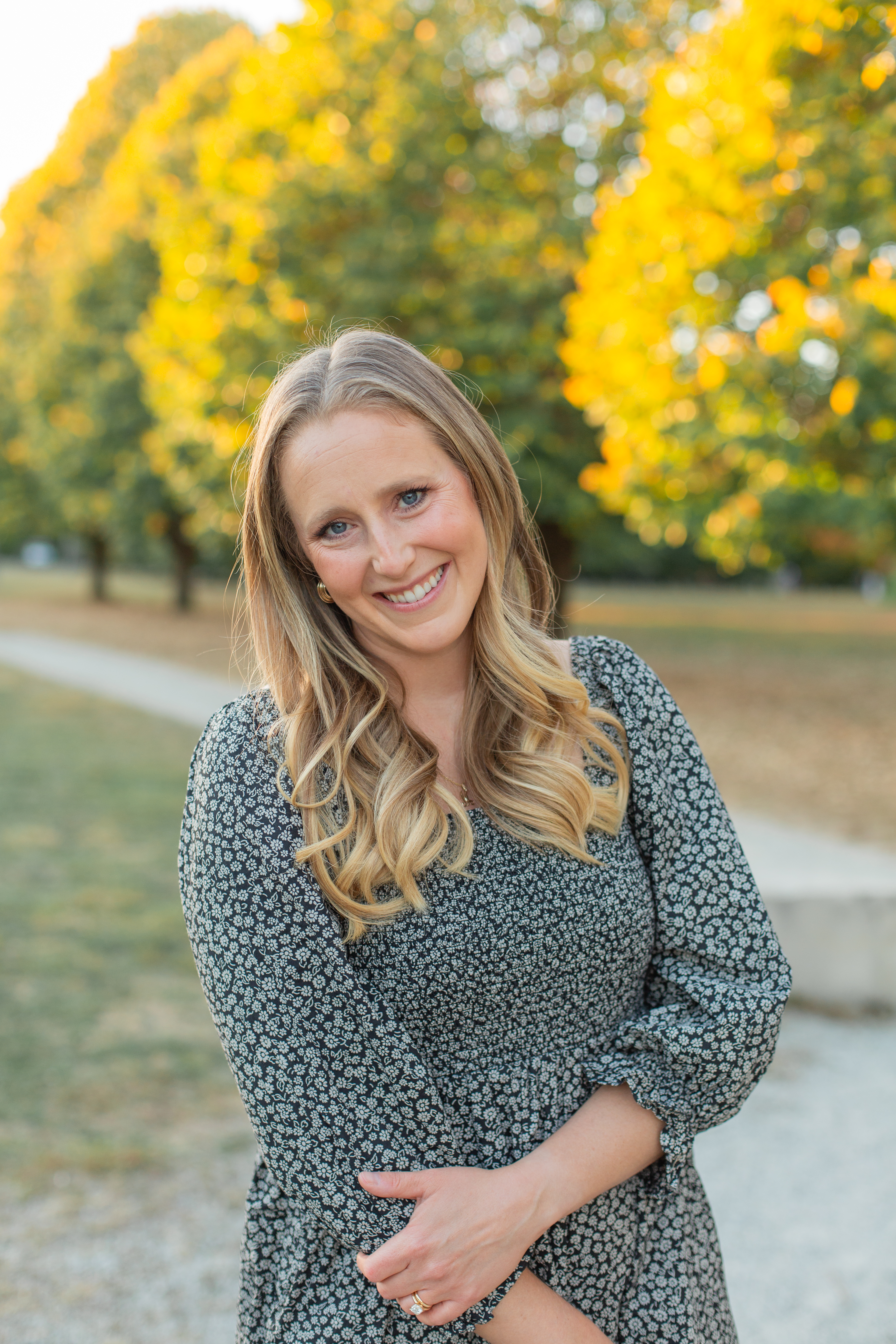 Portrait of Meredith in a warm, natural light home kitchen setting.