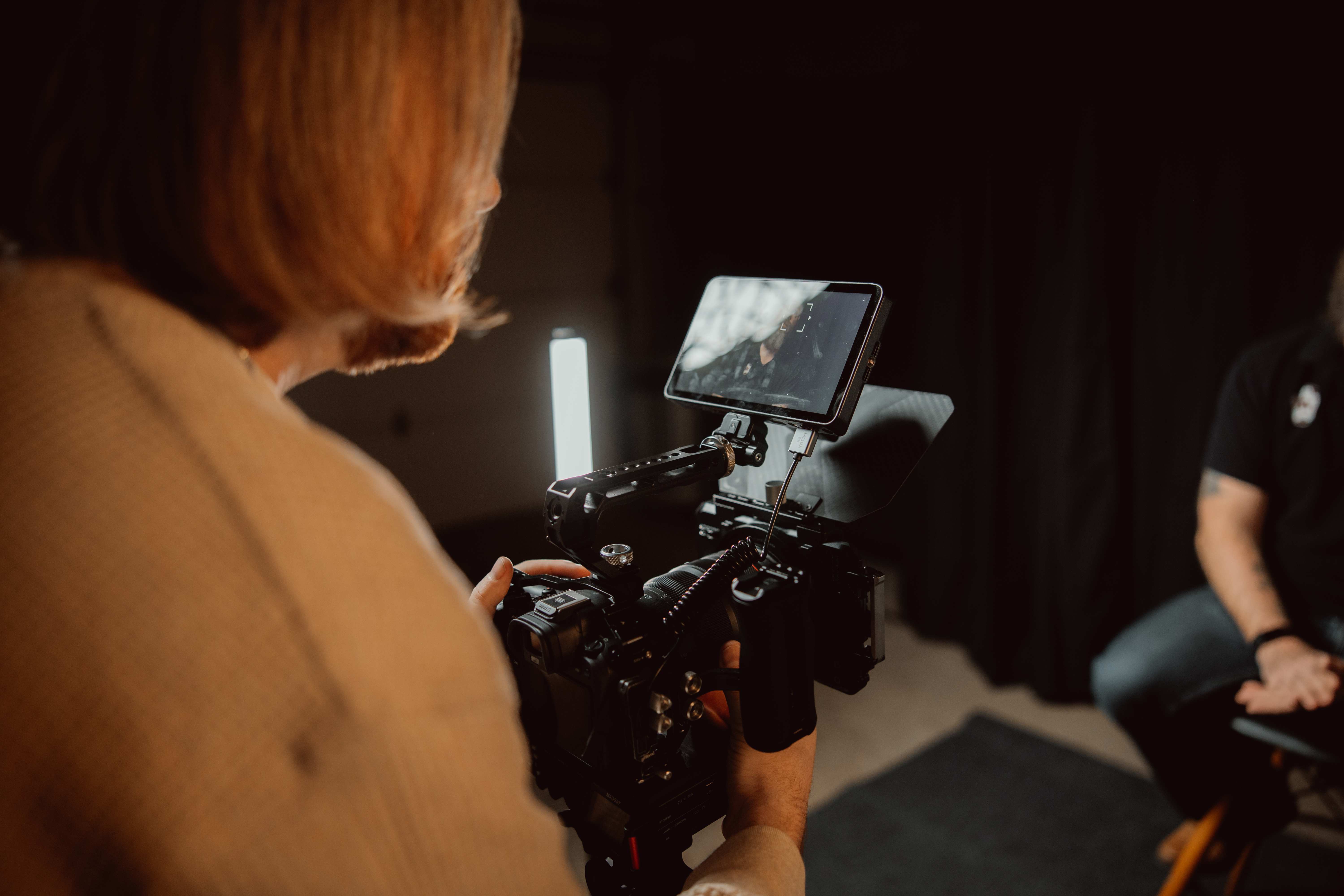 Nick holding camera recording a video commercial for advertising