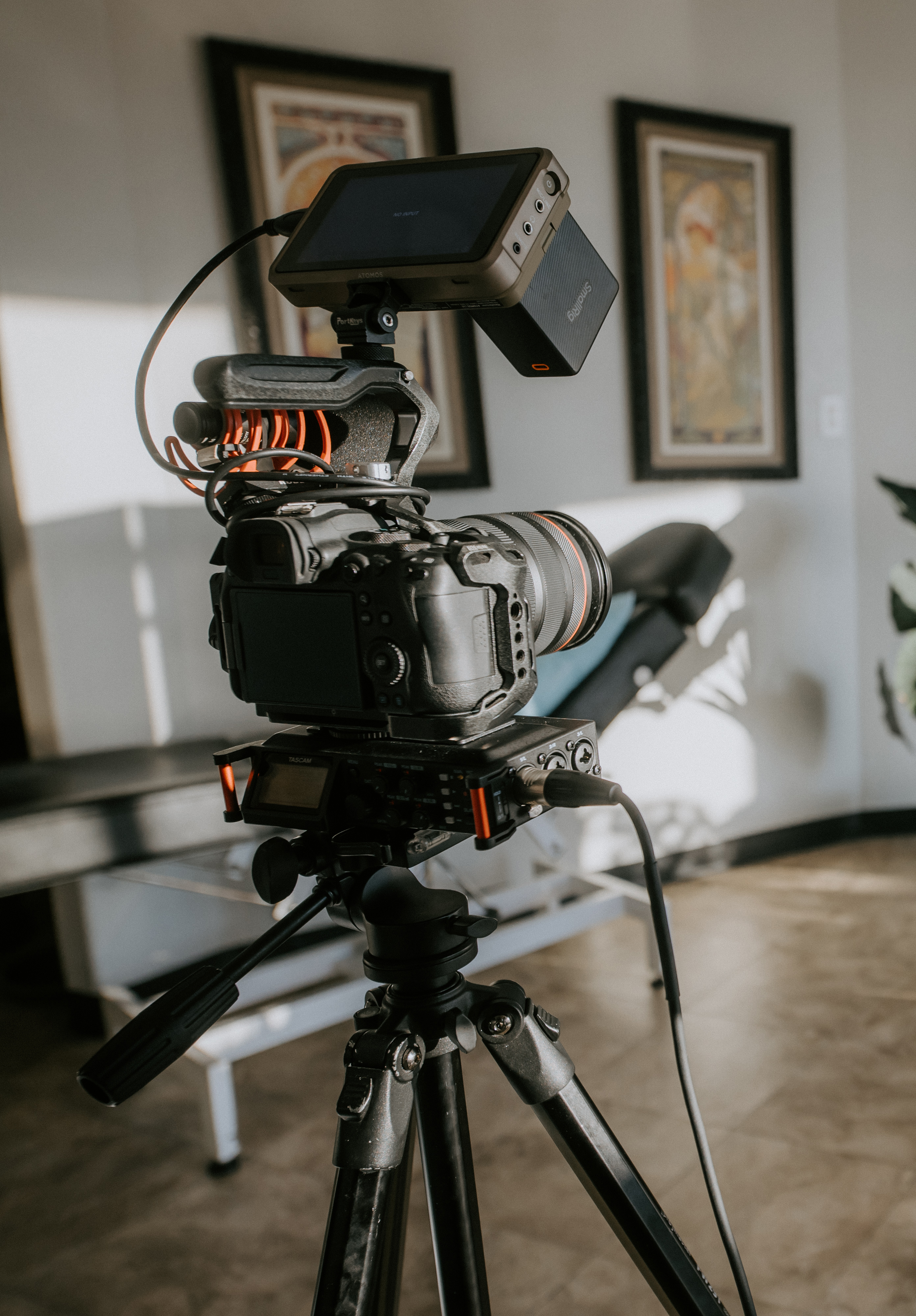 camera on stand recording video of tattoo shop