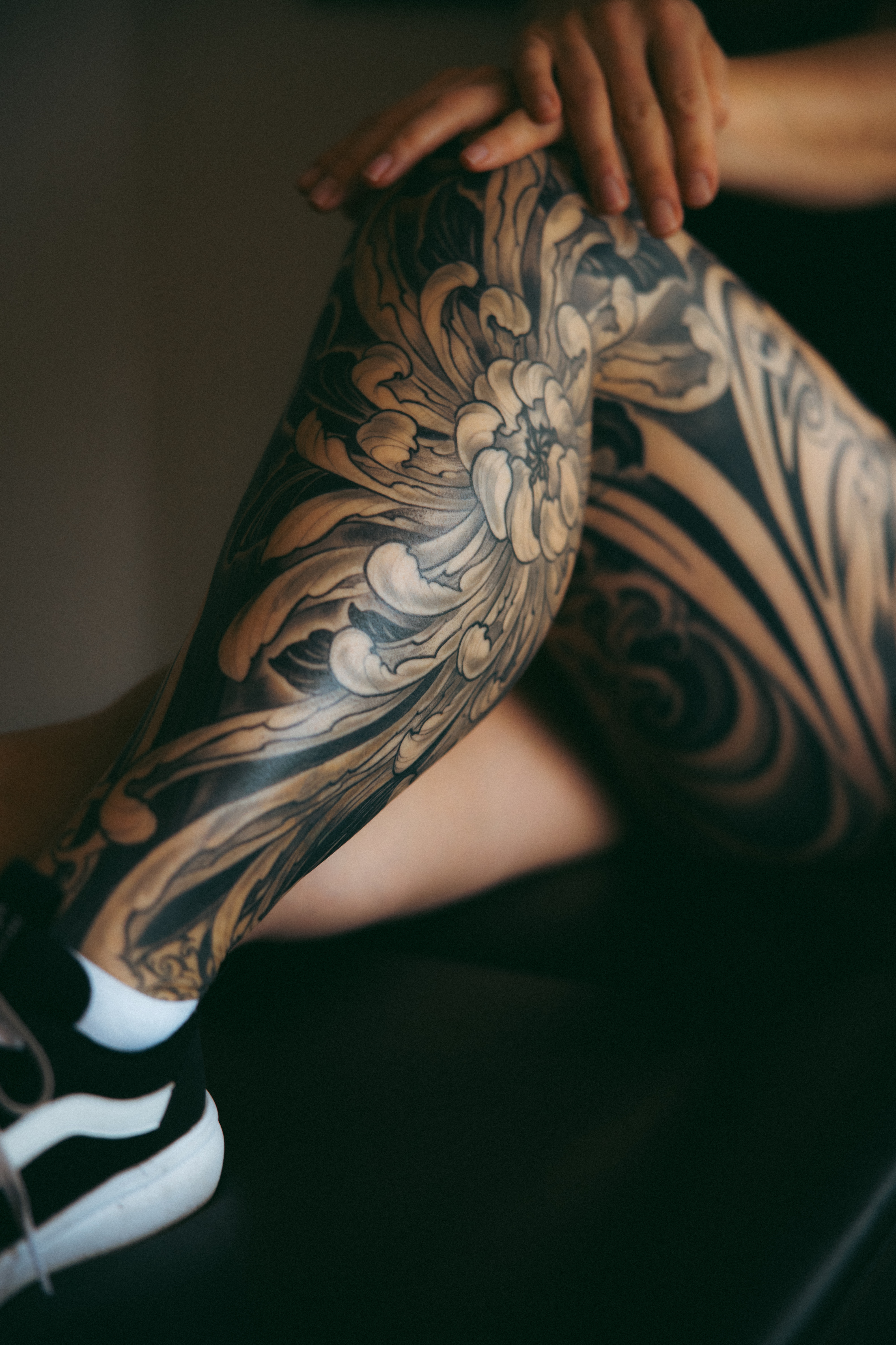 Cover up tattoo of a japanese chrysanthemum leg sleeve