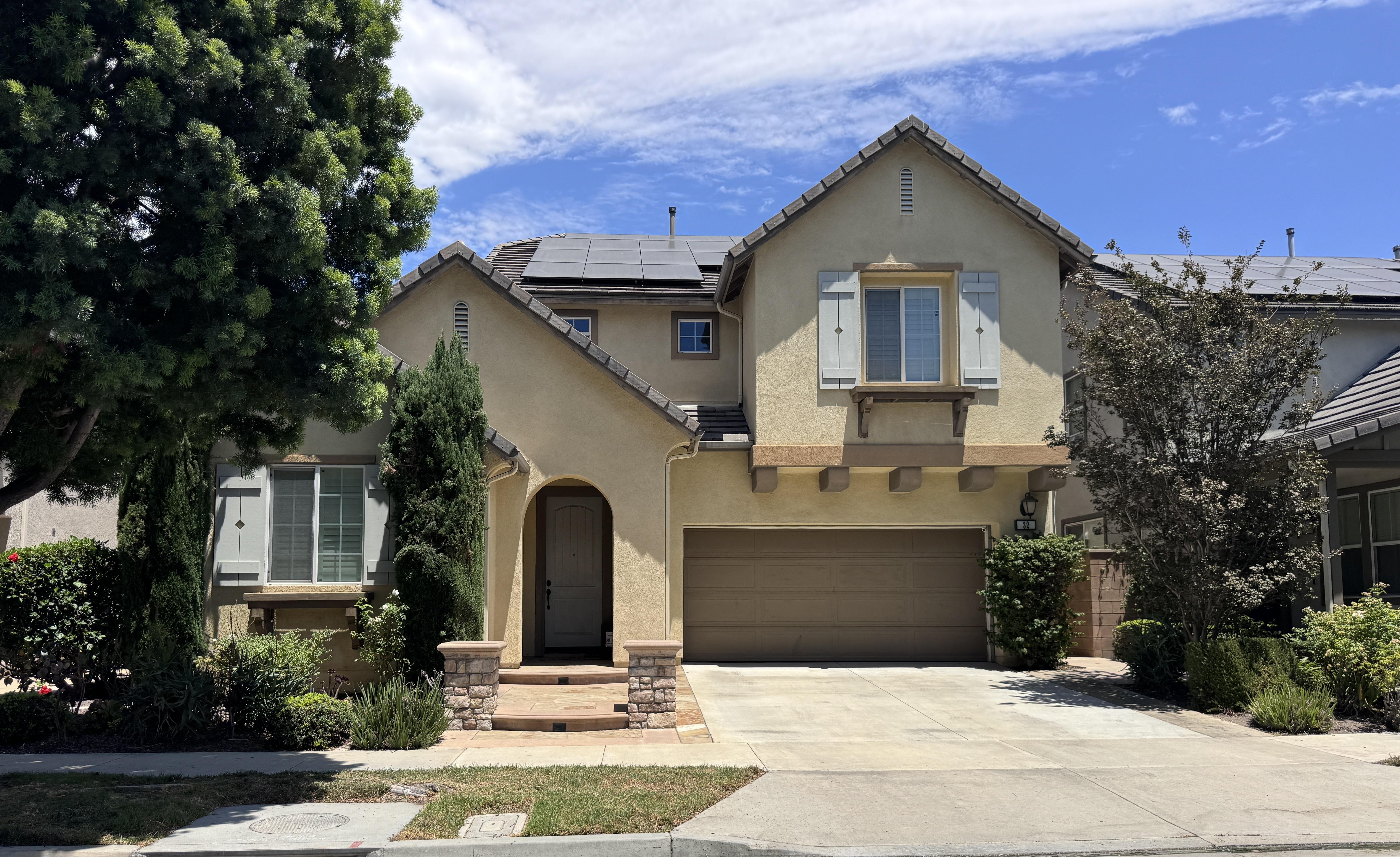 Row of modern Southern California homes on a sunny street