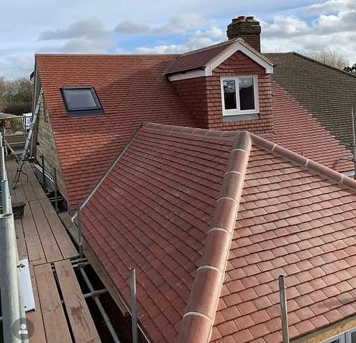New tiled roof with dormer window and ridge tiles by Five Star Roofing