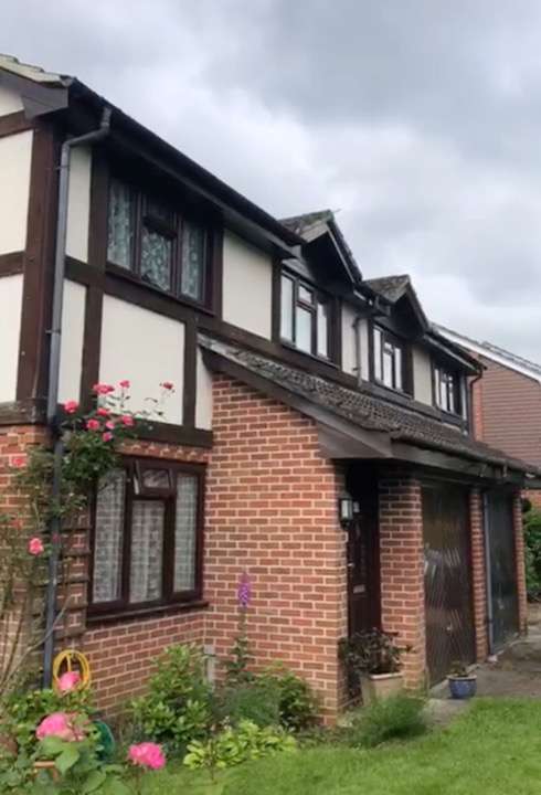 Front view of a house with new fascia boards and guttering replacement