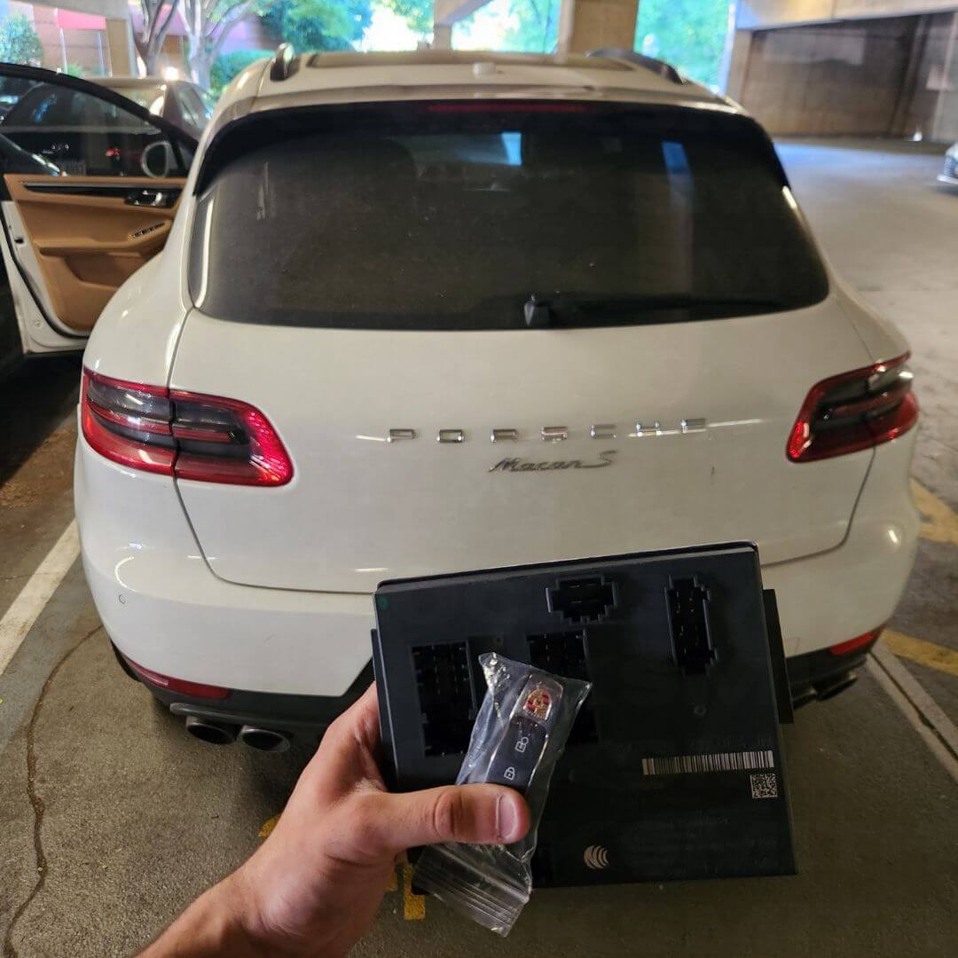 Replacement car key in hand after mobile key cutting and programming
