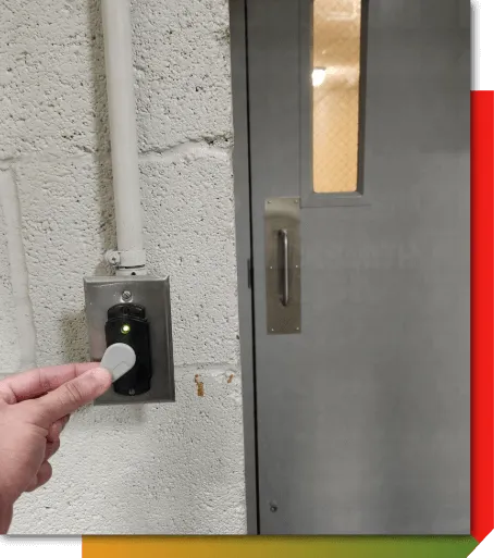 Access control keypad and reader installed at an entry door for controlled access
