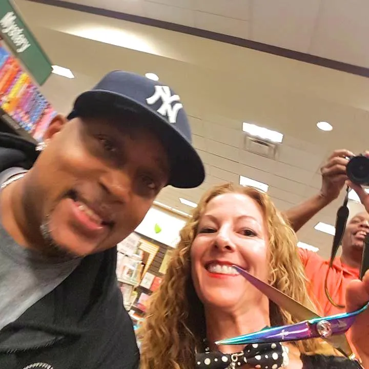 Melanie Nickels with Daymond John