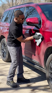 Master detailer applying precision coating to a luxury exotic vehicle