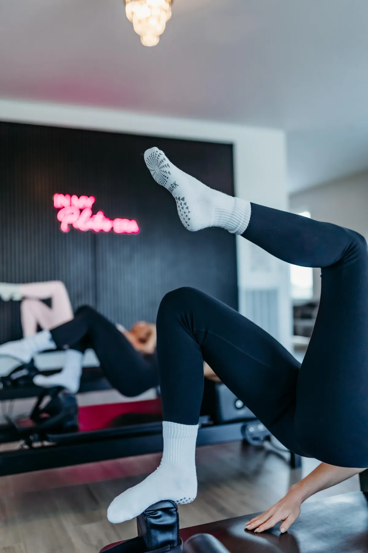 Client practicing reformer Pilates at Studio Skulpt in Spring Hill, TN, building strength, balance, and body awareness in a calm, modern studio
