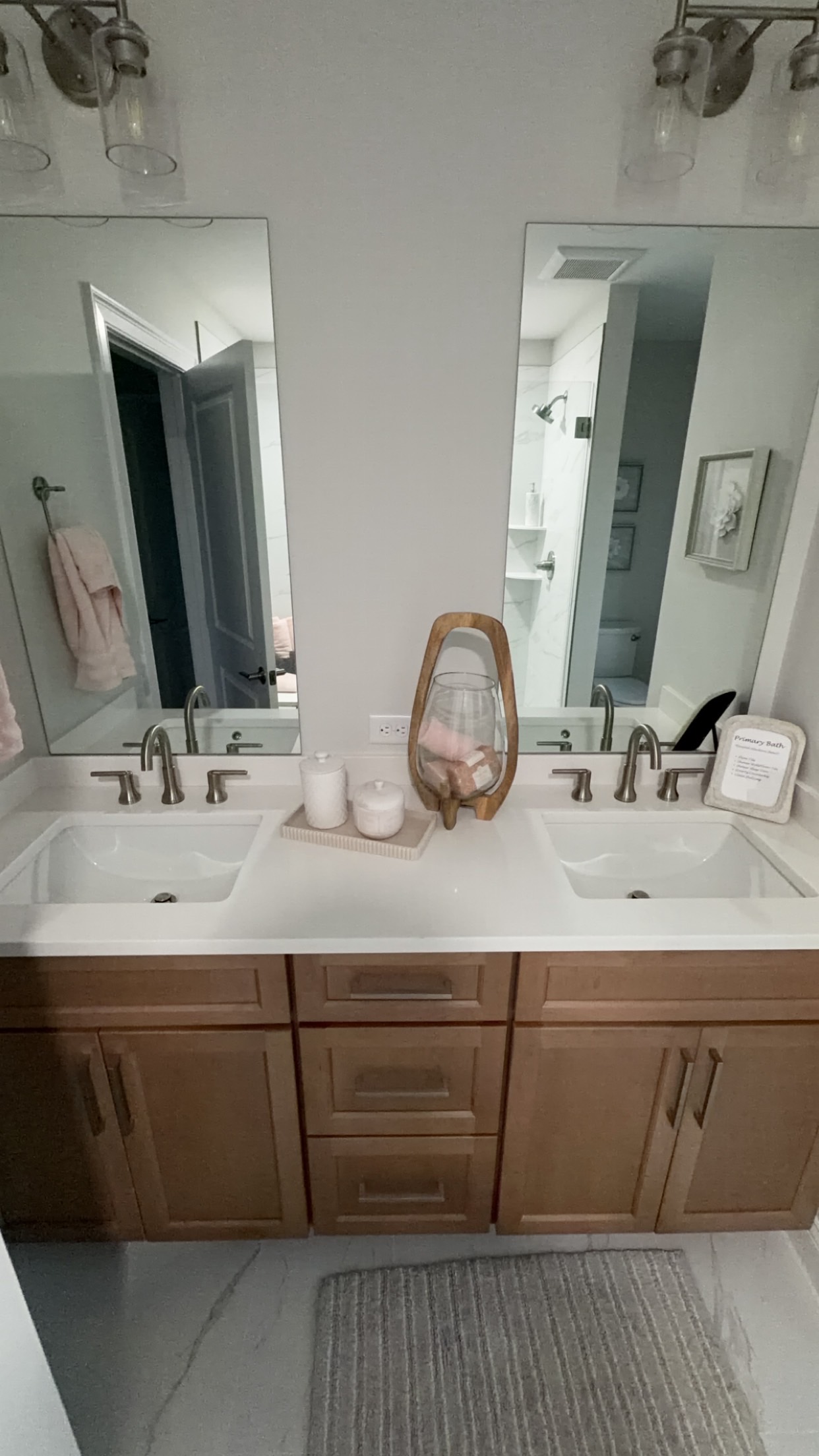 Primary bathroom with double vanity and two undermount sinks plumbed by MJC Plumbing