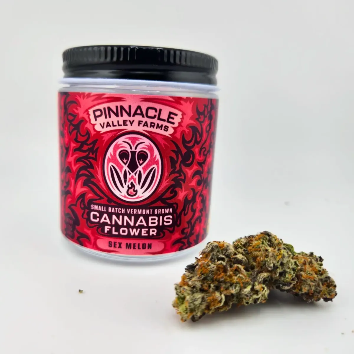 Pinnacle Valley Farms cannabis flower jar labeled “Sex Melon,” small batch Vermont grown, with cannabis bud displayed in front