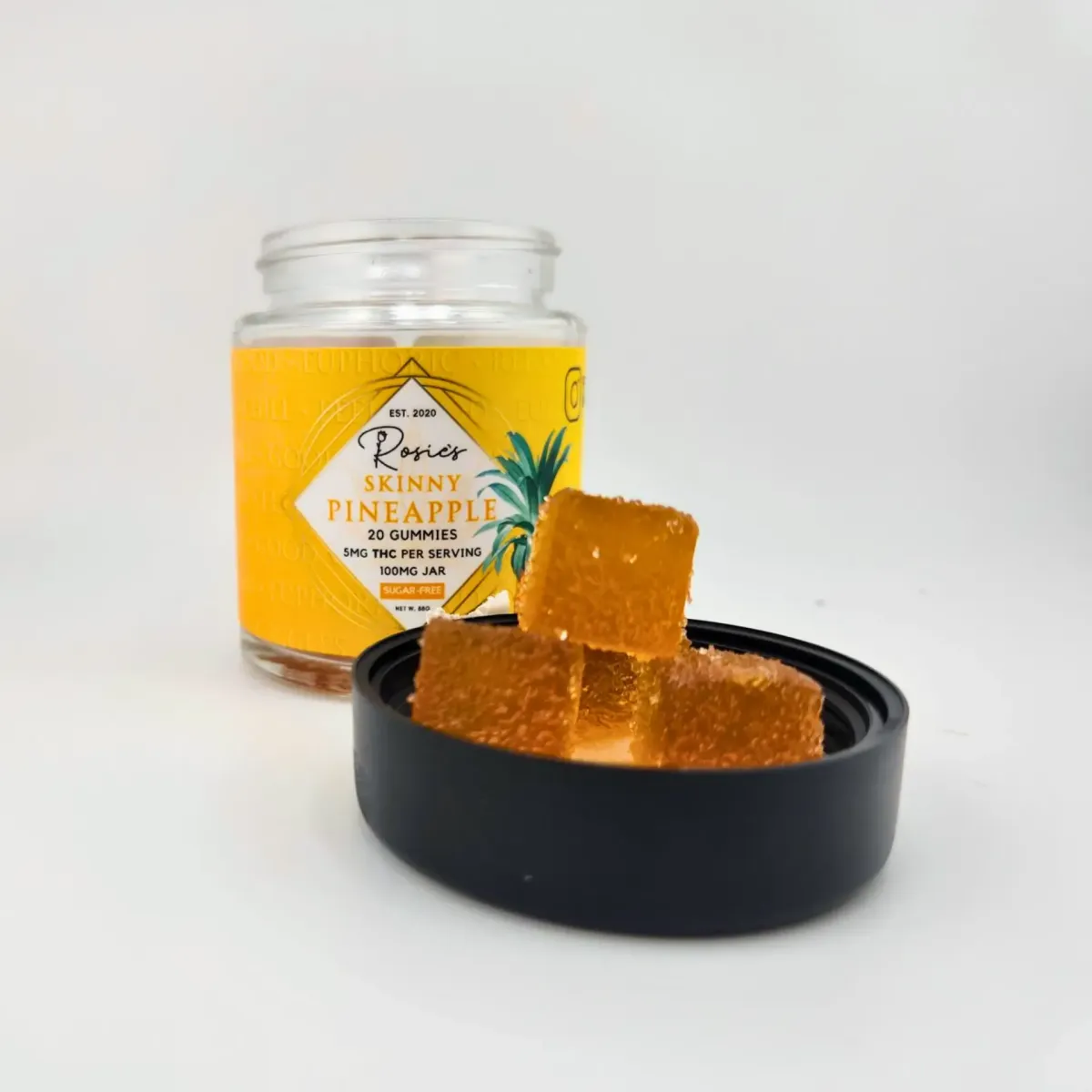 Rosie’s Skinny Pineapple cannabis edibles, jar of 20 gummies with 5mg THC per serving, displayed with sugar-coated pineapple gummies on lid