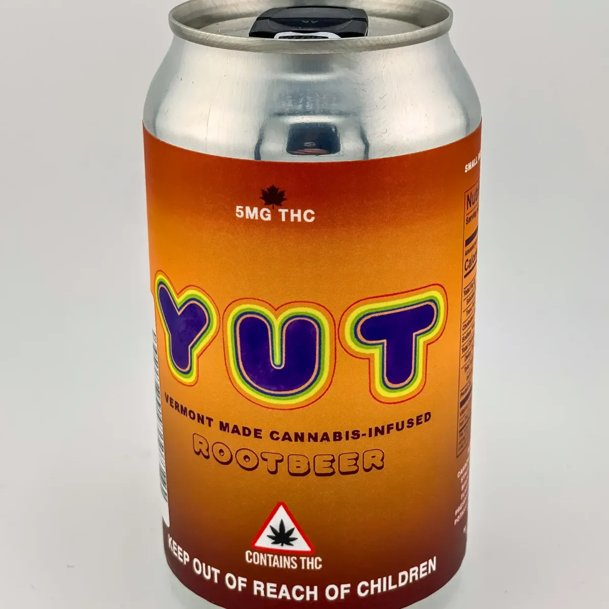 YUT Rootbeer cannabis soda can, Vermont-made THC-infused beverage with 5mg THC, brown-orange label with rainbow lettering and cannabis warning symbol.